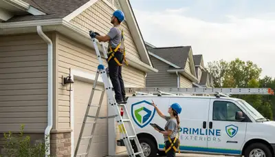 Technician performing vinyl siding and gutter inspection on Tulsa OK home exterior