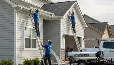 Seamless gutter installation on Tulsa OK home by Next Level Exteriors vinyl siding specialists